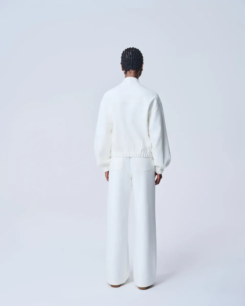 Giacca bianca con zip e tasche con patta